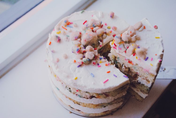 Birthday cake being sliced