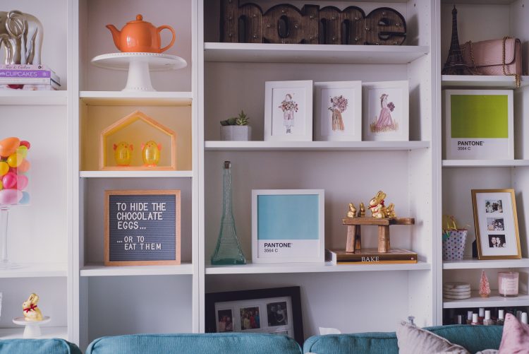 cheerful and bright living room bookcase decorated for easter