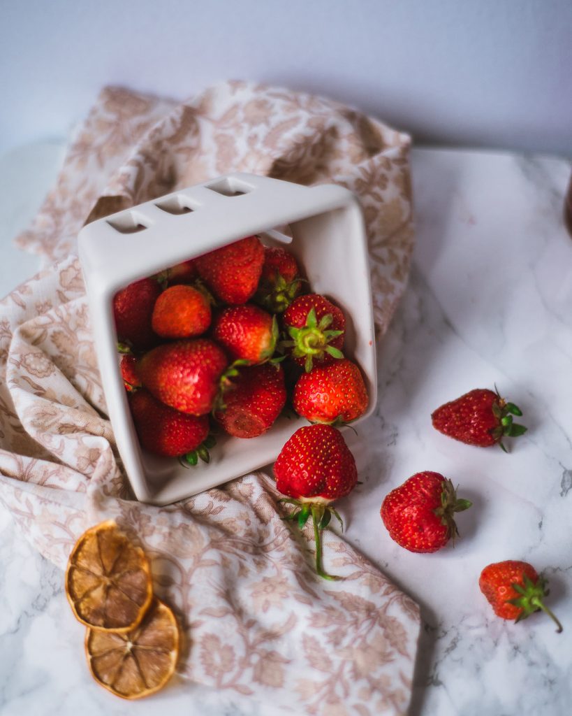 A basket of strawberries on a table